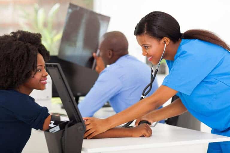 allied health medical assistant helping a patient