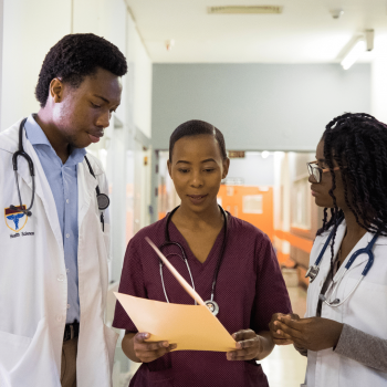 Medical billing and coding (2) medical billing and coding specialist working with a nurse and doctor